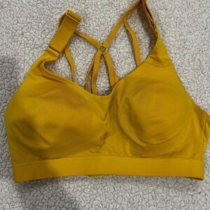 Calia yellow sports bra size SM. Bra closure in bk & adjustable straps.